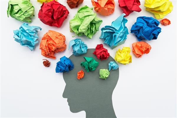 Head with many different colored crumpled balls of paper coming out like thoughts